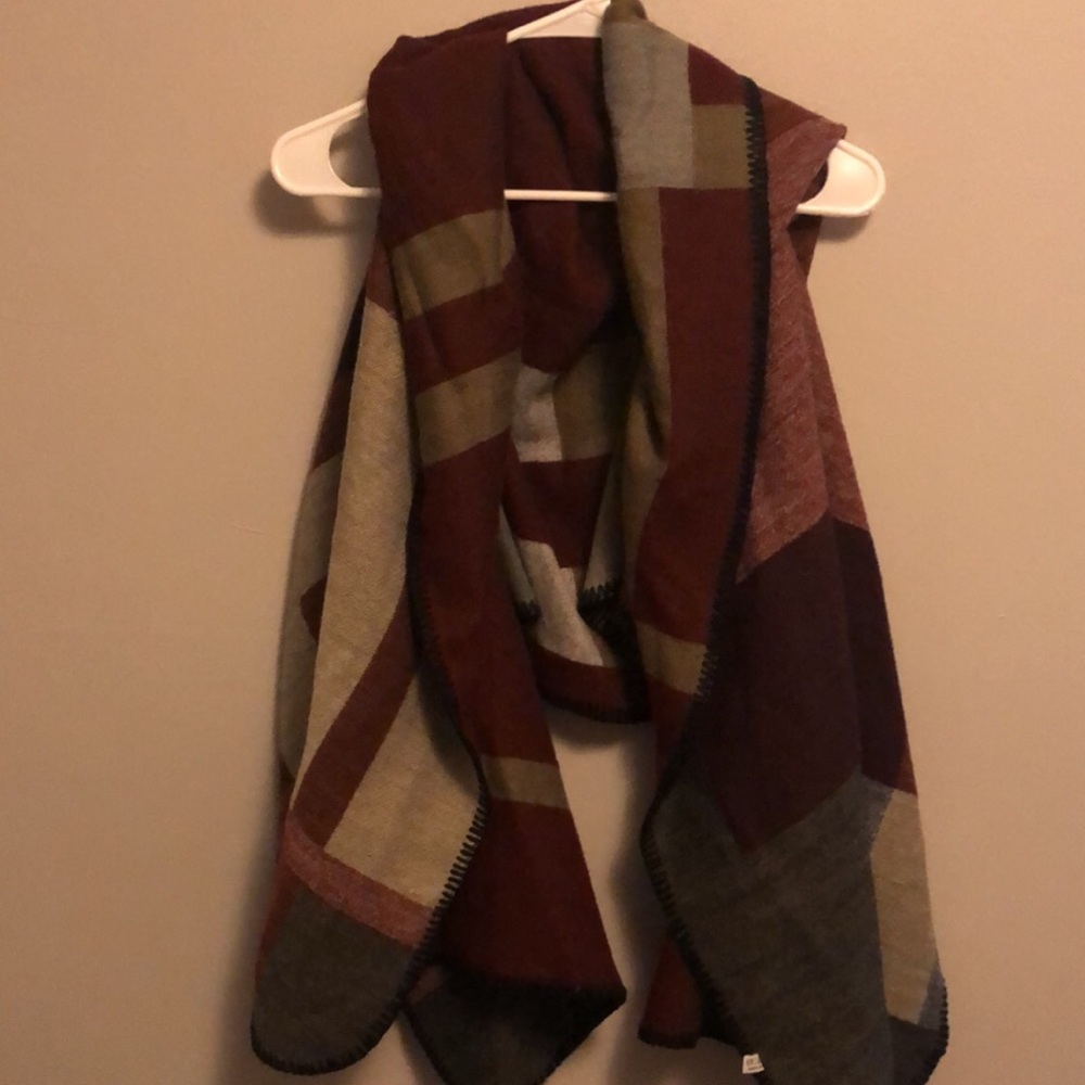Burgundy, tan, light and dark grey blanket vest.